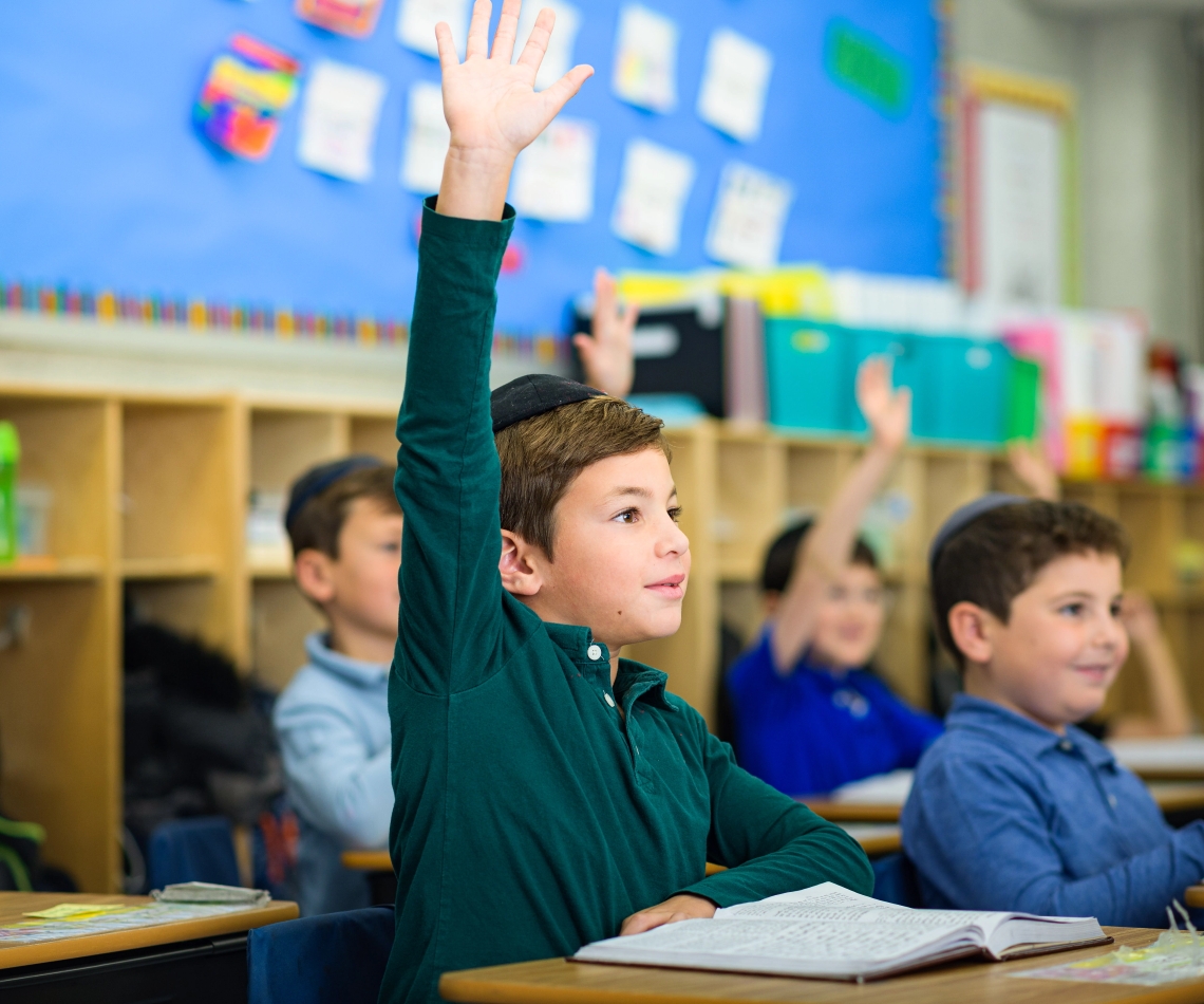 Boys raising hands